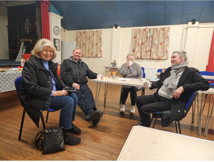 Visitors enjoying coffee together at Pippa's Community Café in Stone Village Hall